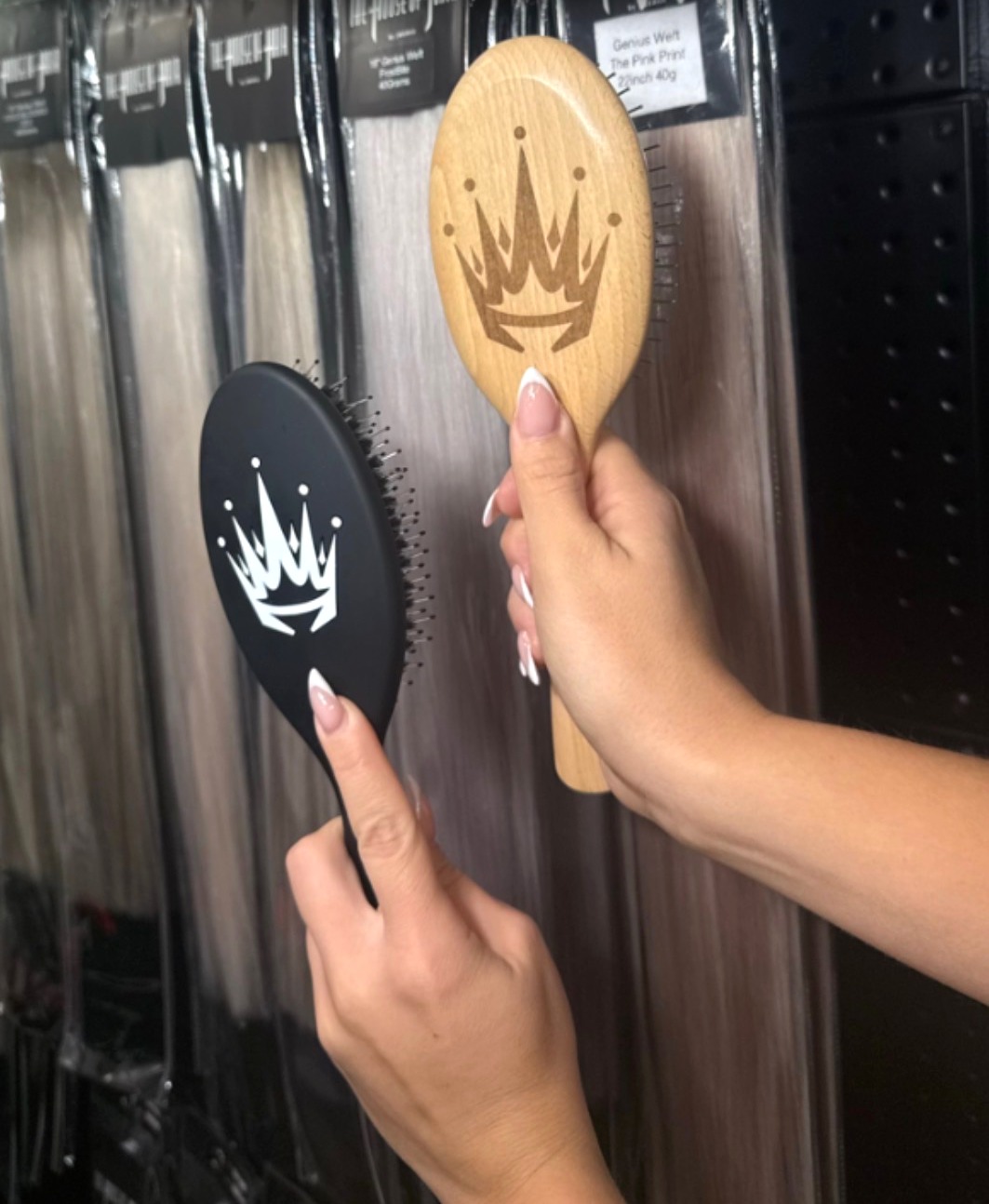 The MANES by MEDiii wooden signature brush and The House of Hair black signature brush held side by side.