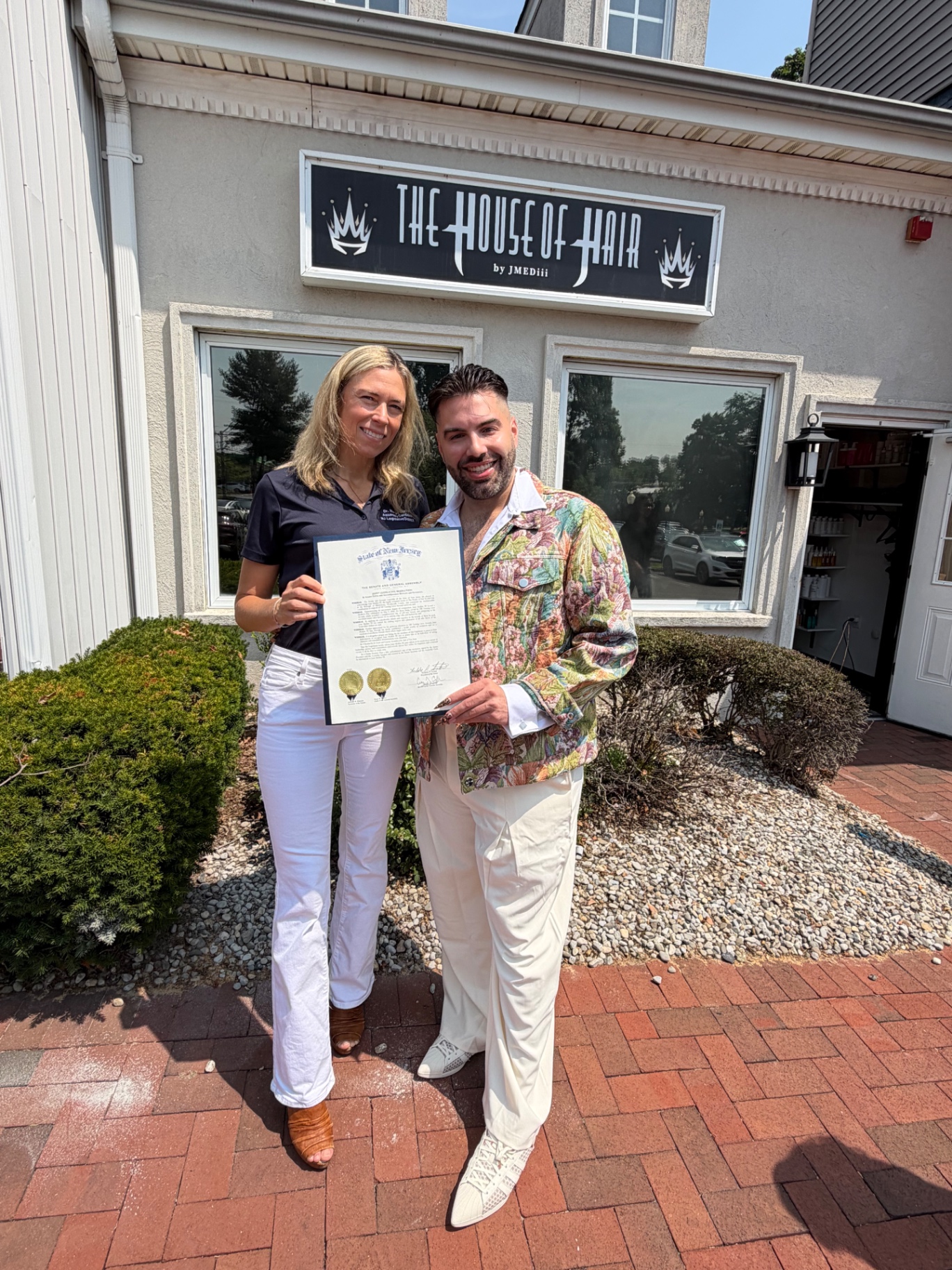 JMEDiii receiving the State of New Jersey proclamation outside The House of Hair.
